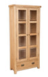 Melbourne Natural Oak tall display cabinet with glass doors on a white background. Available from A Quirky Corner, Banbury.
